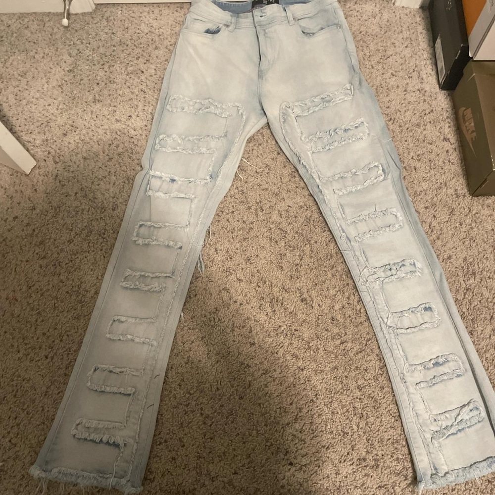 Blue Stacked Jeans with Distressed Detailing